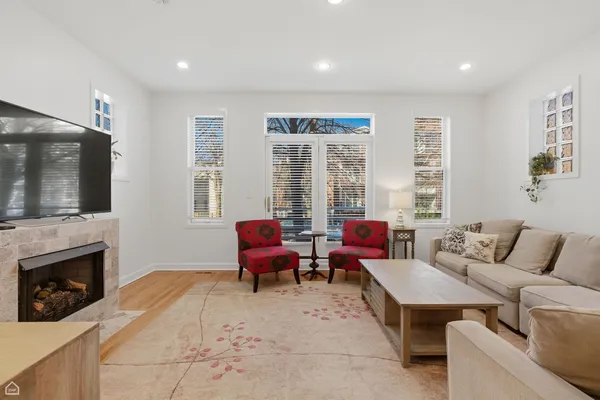 a living room with furniture and a fireplace