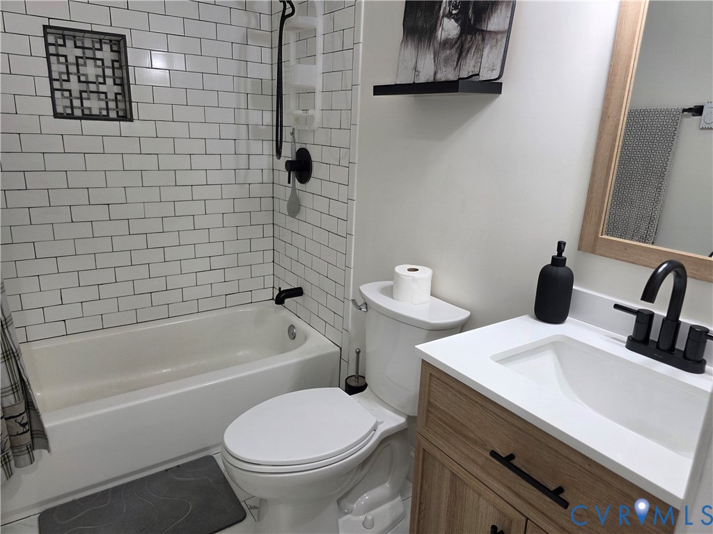 11782 Mt Landing Road Tappahannock, VA 22560 - Photo 11 of 15 a bathroom with a sink a toilet and bathtub