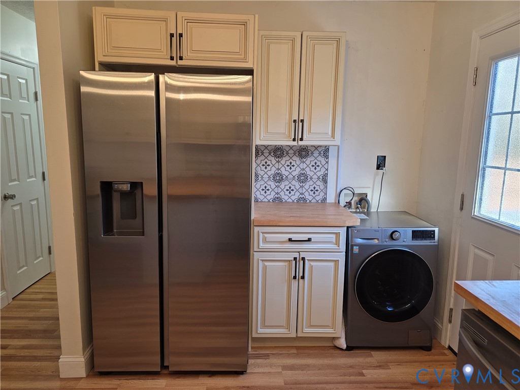 11782 Mt Landing Road Tappahannock, VA 22560 - Photo 6 of 15 a kitchen with a refrigerator and cabinets