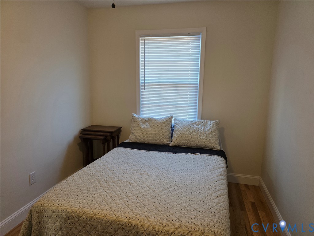 11782 Mt Landing Road Tappahannock, VA 22560 - Photo 9 of 15 a bedroom with a bed and a window