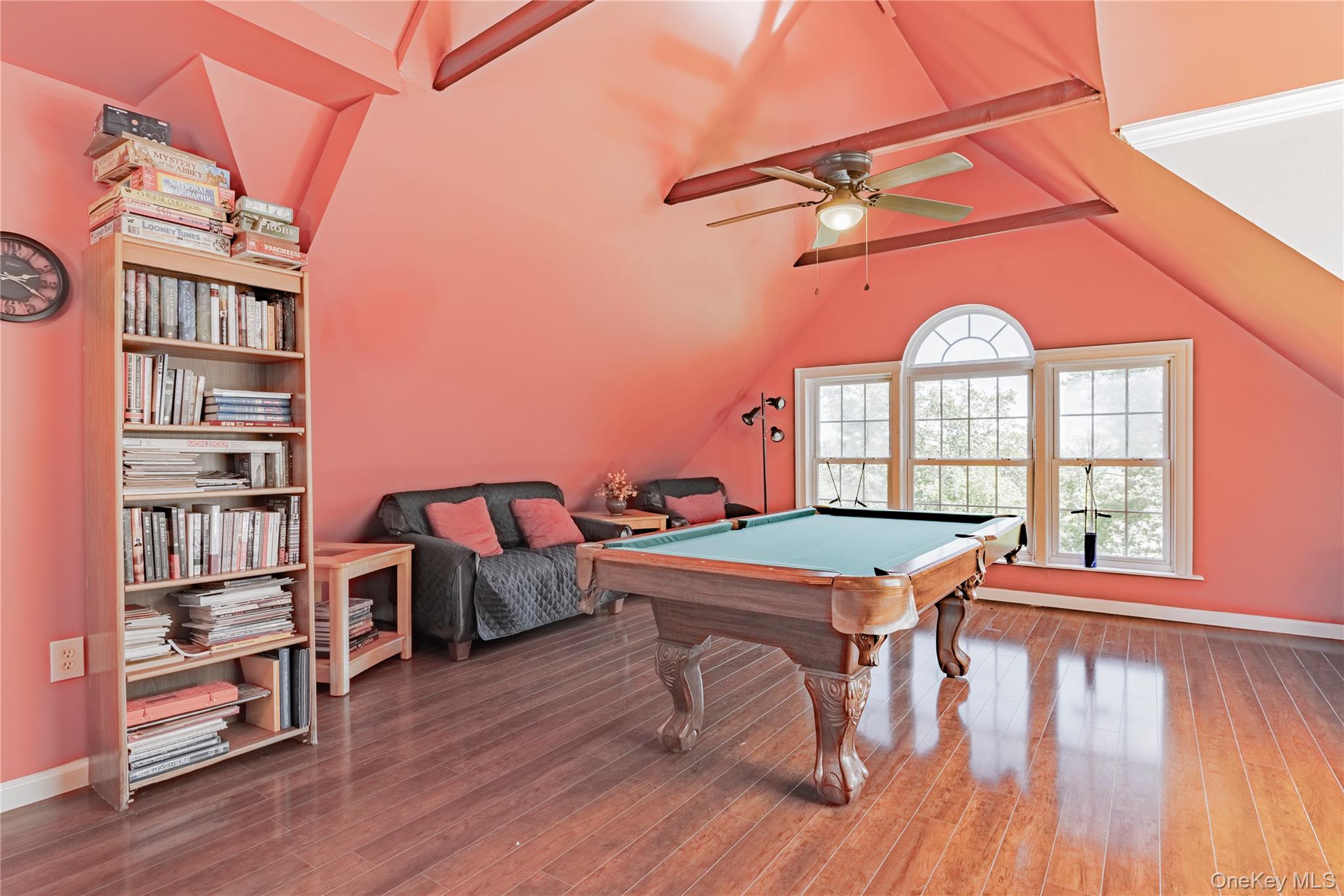 291 Woodmont Road Hopewell Junction, NY 12533 - Photo 21 of 49 a room with furniture a rug and a book shelf