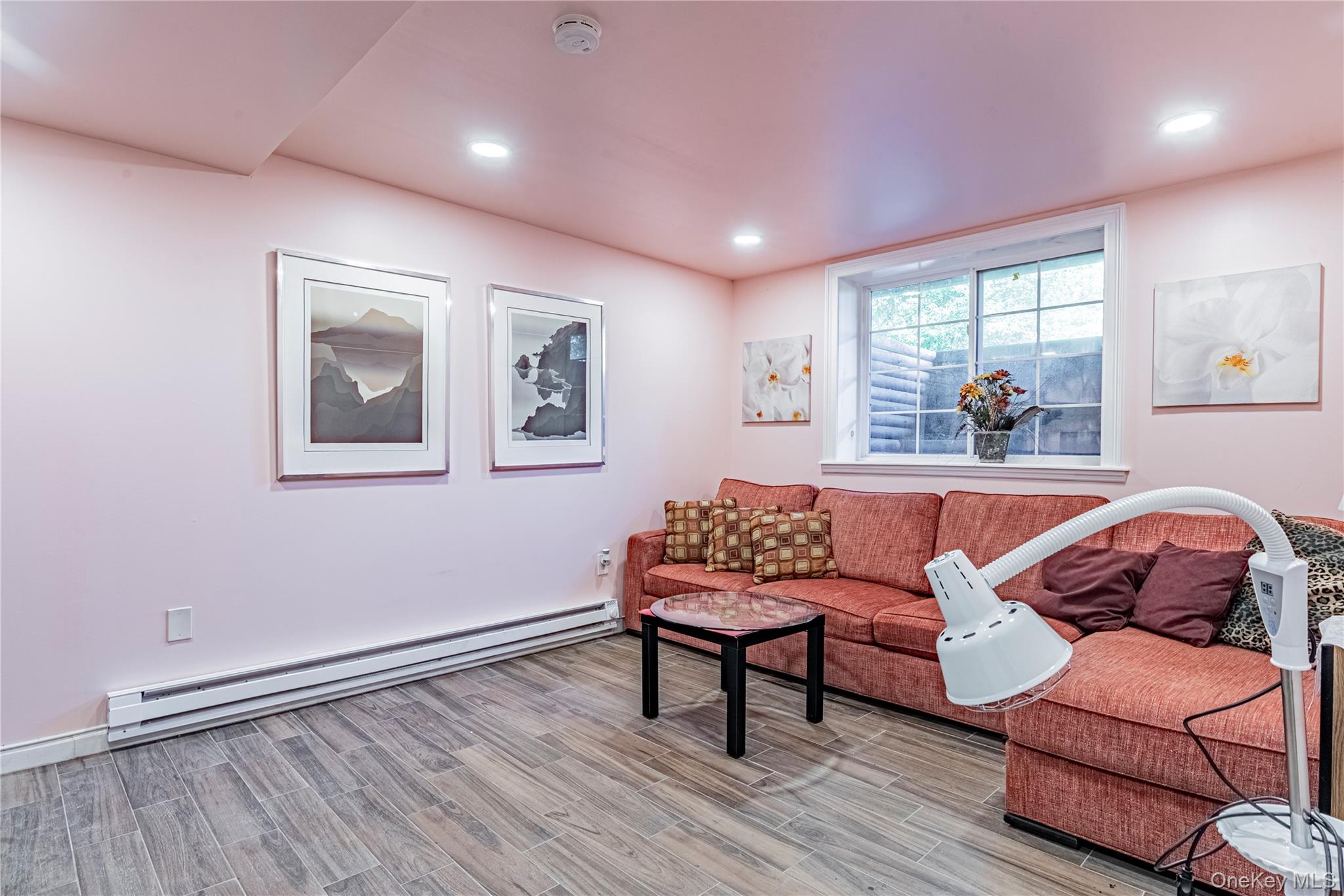 291 Woodmont Road Hopewell Junction, NY 12533 - Photo 38 of 49 Living room featuring a baseboard radiator, light wood-type flooring, and recessed lighting