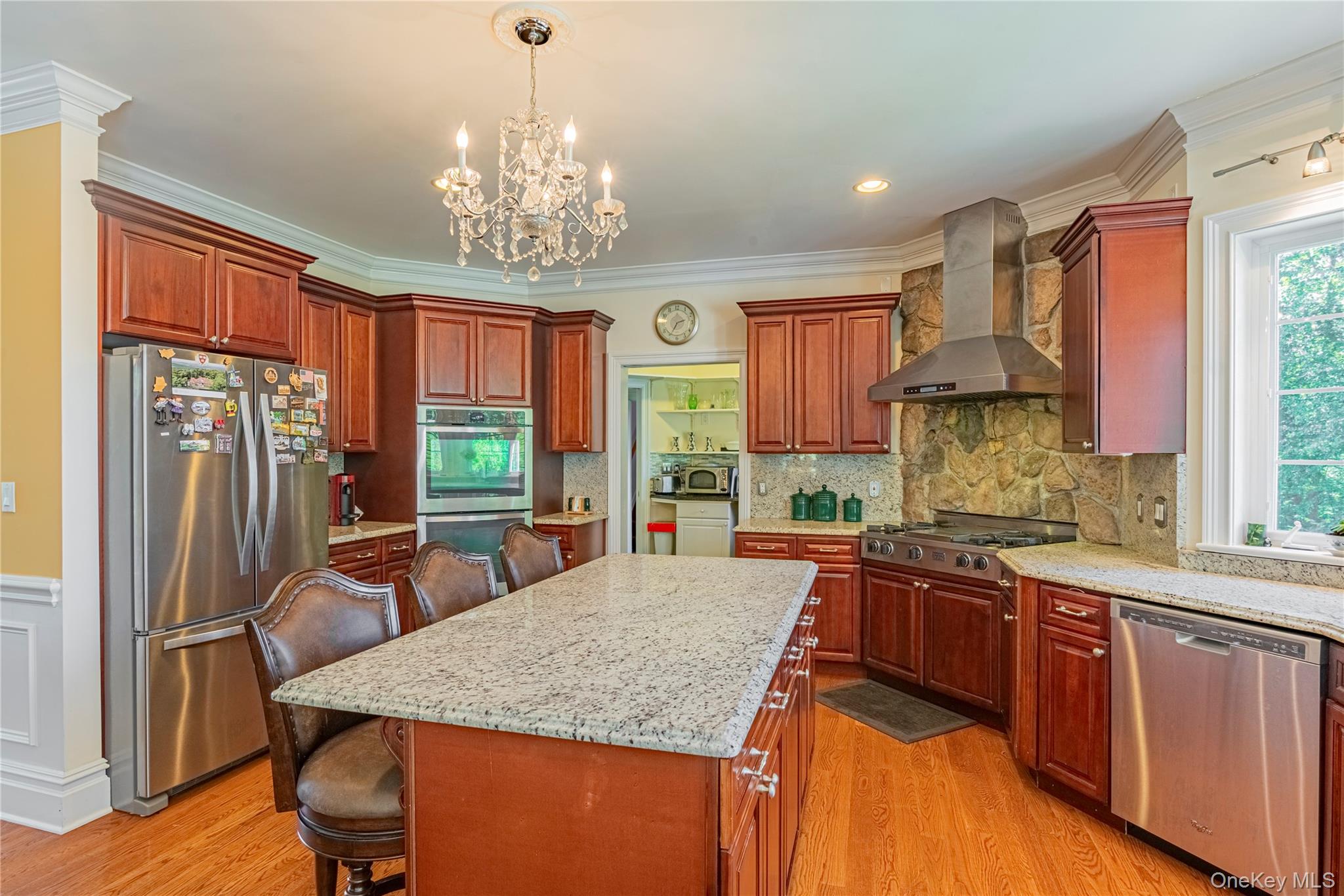 291 Woodmont Road Hopewell Junction, NY 12533 - Photo 42 of 49 a kitchen with stainless steel appliances granite countertop sink stove refrigerator and cabinets