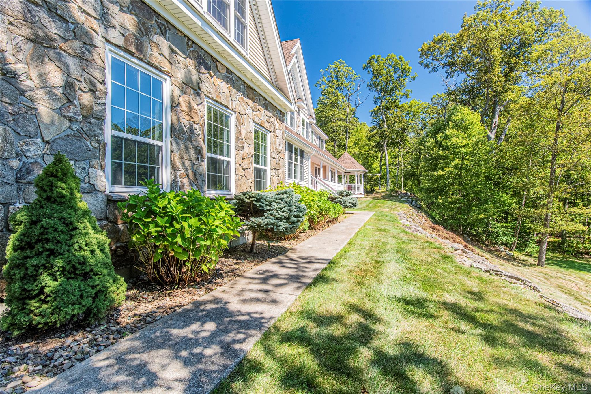 291 Woodmont Road Hopewell Junction, NY 12533 - Photo 6 of 49 a view of a building with a garden