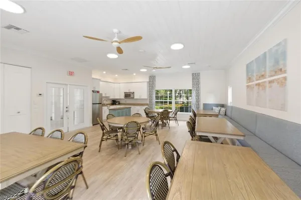 a dining room with furniture and a chandelier