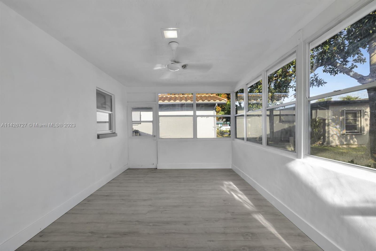 4964 Northwest 48th Way Tamarac, FL 33319 - Photo 7 of 16 a view of an empty room with a window