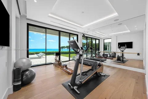 a bedroom with furniture and a large window