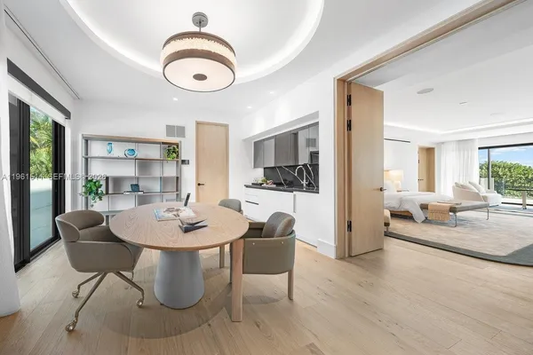 a kitchen with stainless steel appliances kitchen island a chandelier