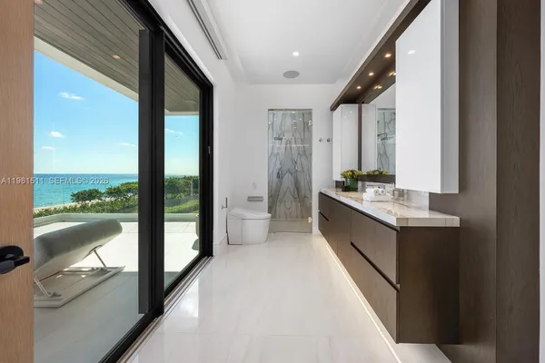 a bathroom with a double vanity sink a mirror and a shower