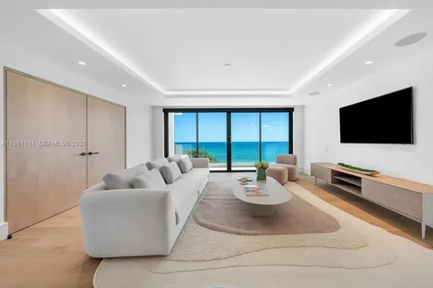 a palm tree sitting in front of a house with a yard