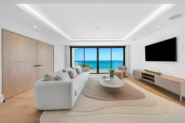 a palm tree sitting in front of a house with a yard