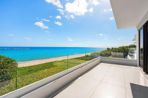 an aerial view of a residential houses with city view
