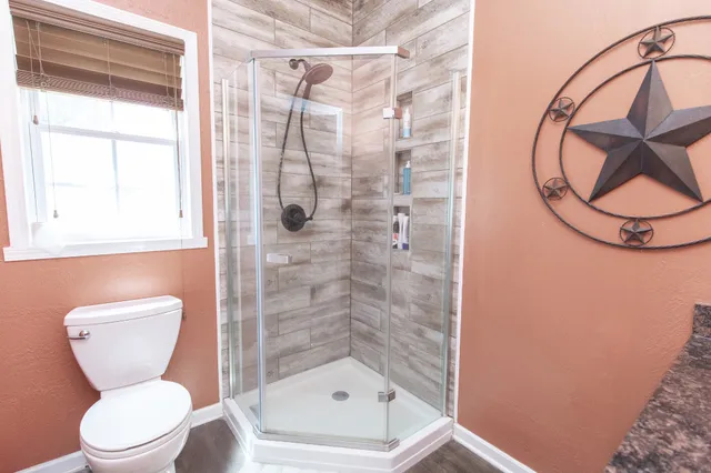 a living room with furniture a fireplace and a chandelier