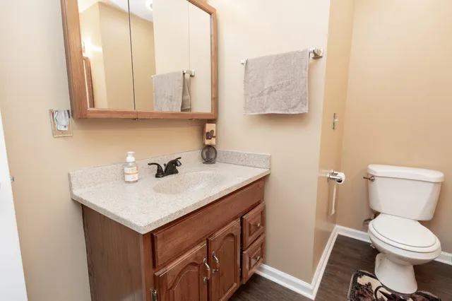 a spacious bedroom with a large bed and a large window