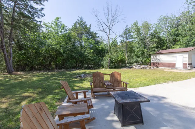 a view of a patio with a yard