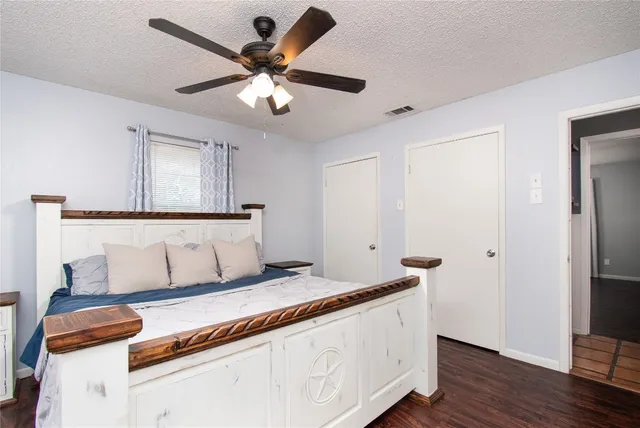 a living room with a bed furniture and a window