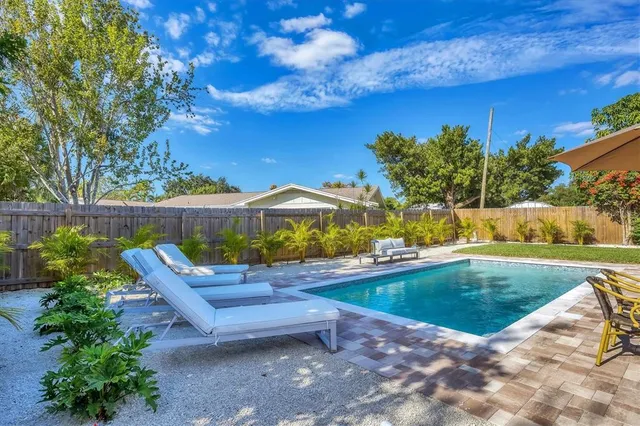 a view of a swimming pool with a patio