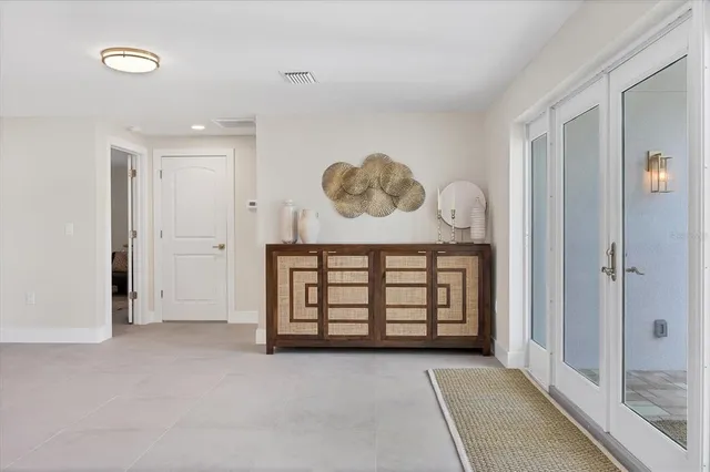 a view of a hallway with windows