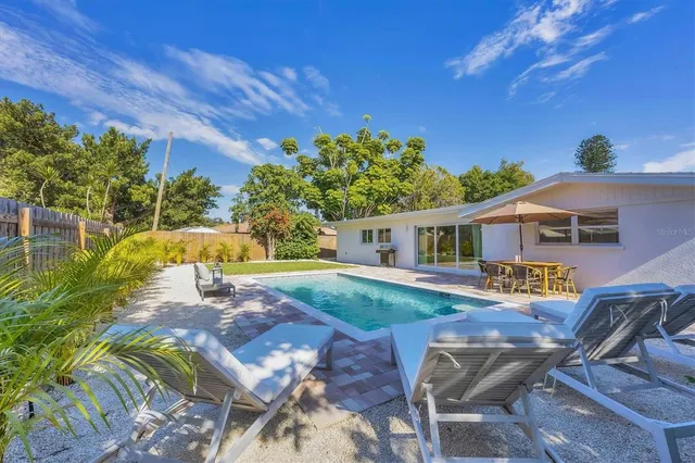 a front view of house with yard and seating area