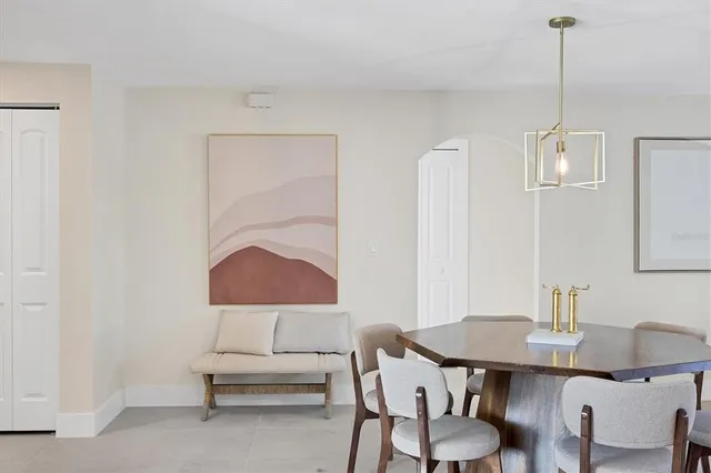 a view of a room with a table and chairs