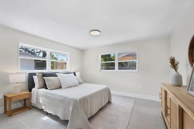 a spacious bathroom with a double vanity sink and a mirror
