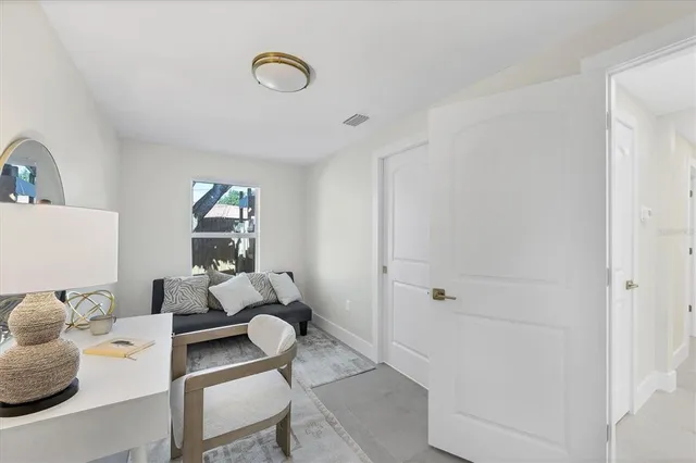 a bedroom with bed and window