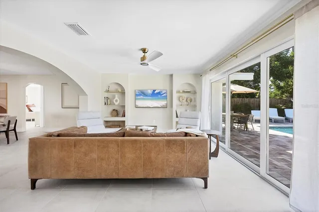 a living room with a couch and a large window