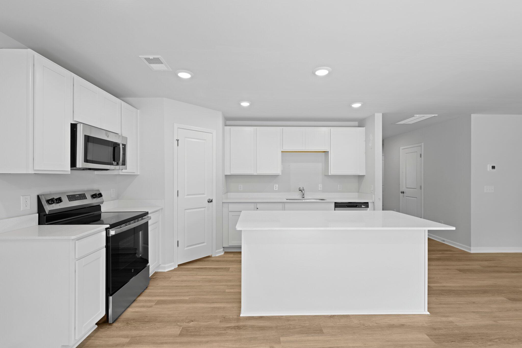 4147 Rising Tide Drive Summerville, SC 29485 - Photo 7 of 54 Kitchen Open to Breakfast Area