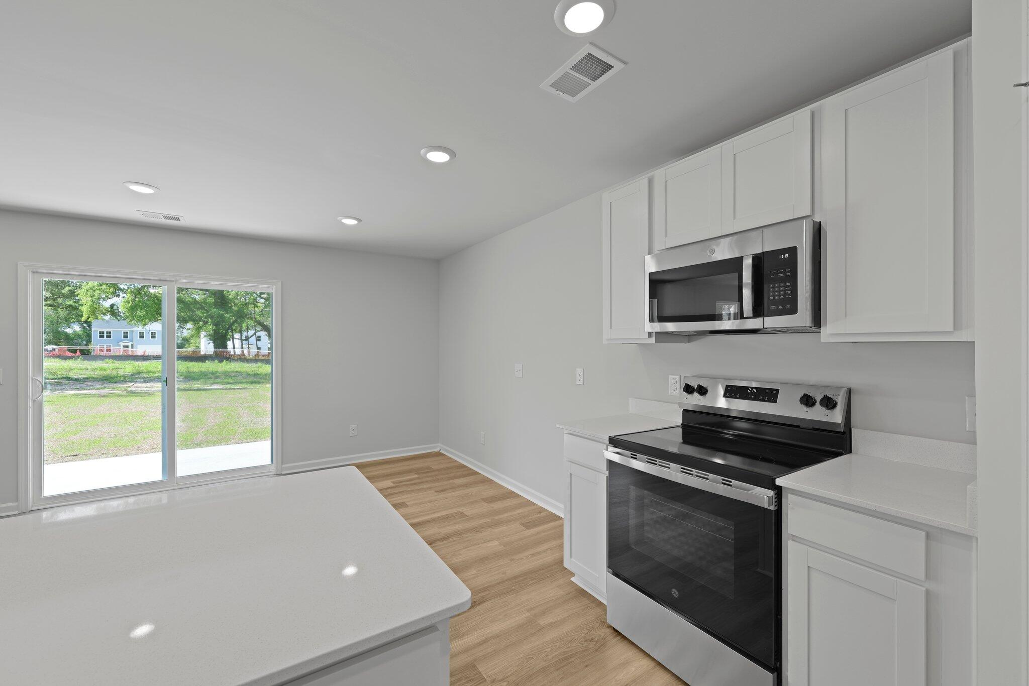 4147 Rising Tide Drive Summerville, SC 29485 - Photo 9 of 54 Sliding Door Open to Patio off Kitchen