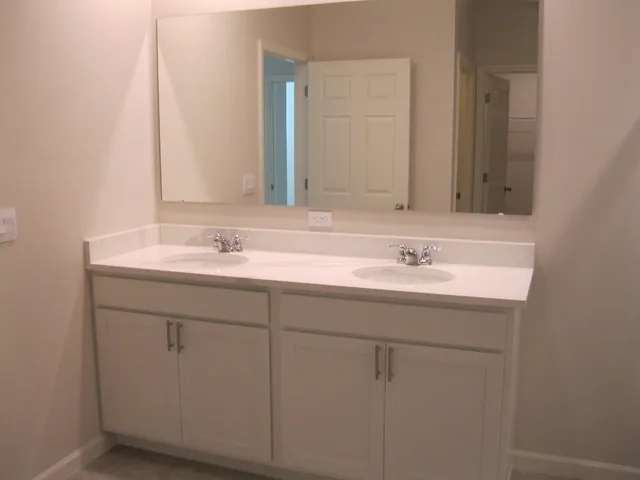 an empty room with closet area