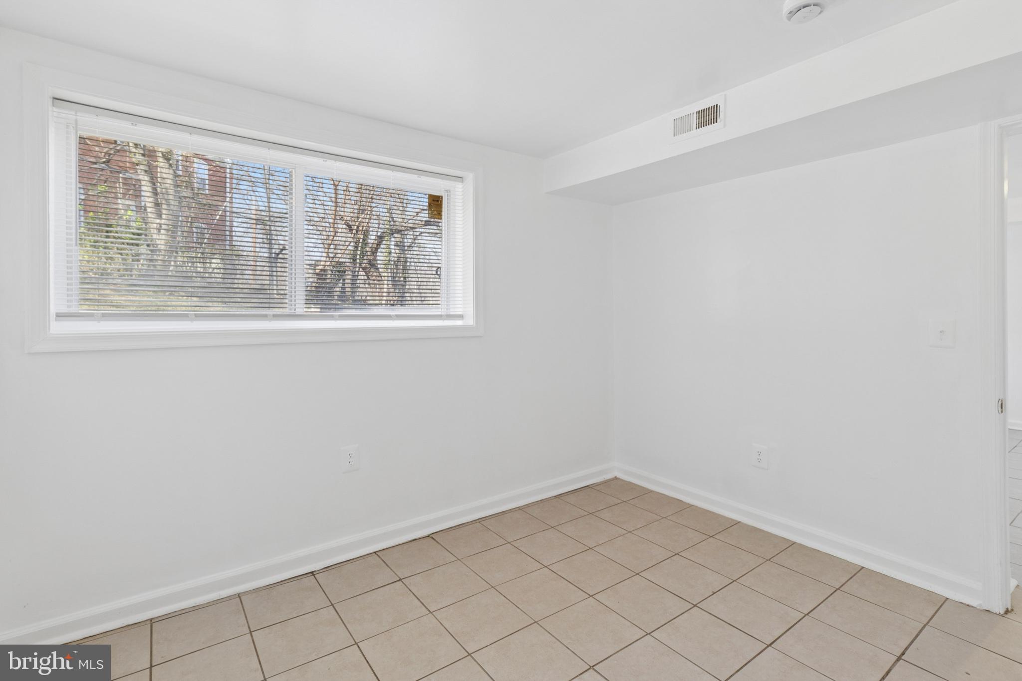 407 Lebaum Street Southeast, Unit 4 Washington, DC 20032 - Photo 16 of 18 a view of an empty room with a window