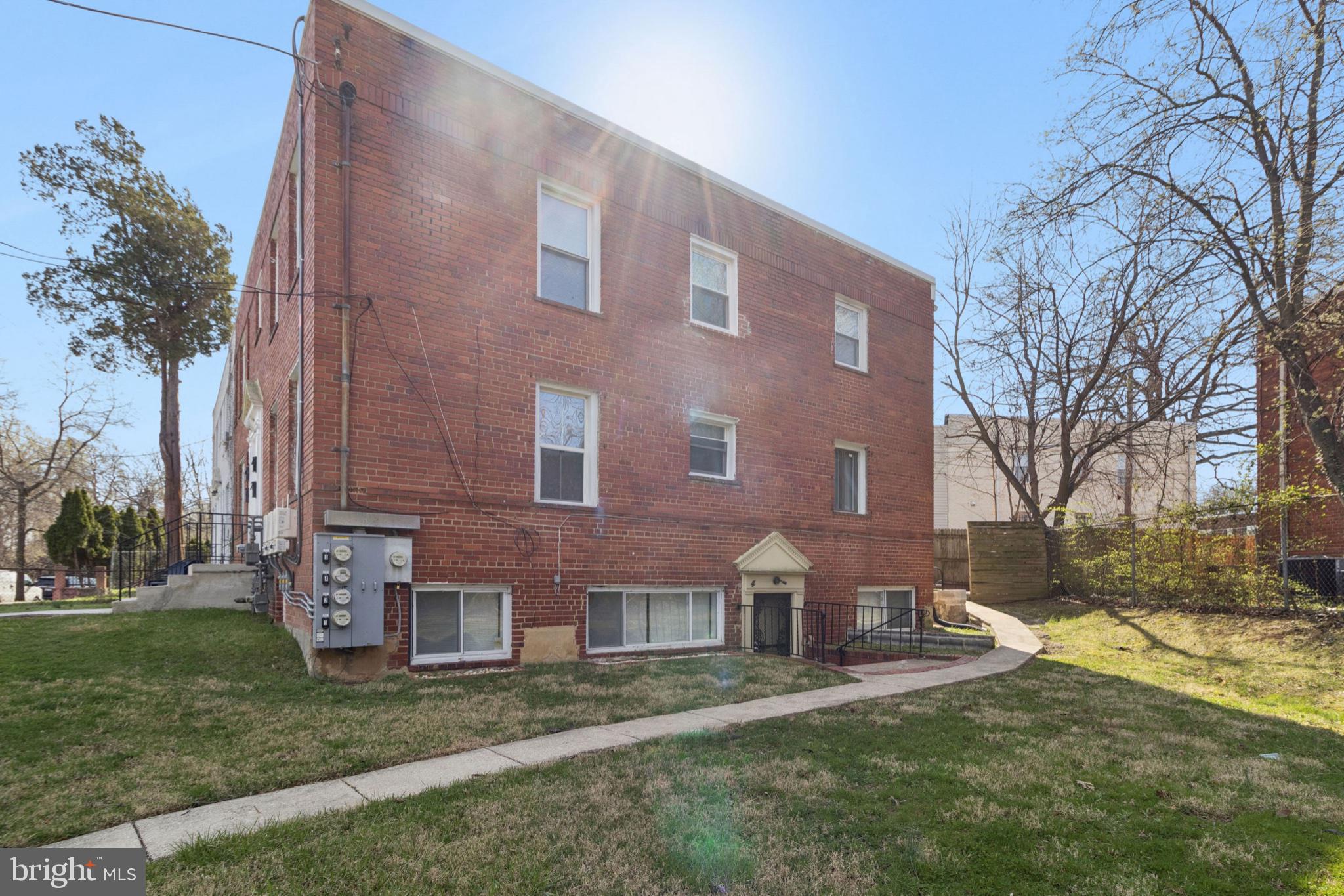 407 Lebaum Street Southeast, Unit 4 Washington, DC 20032 - Photo 18 of 18 a brick building that has a lots of windows in it