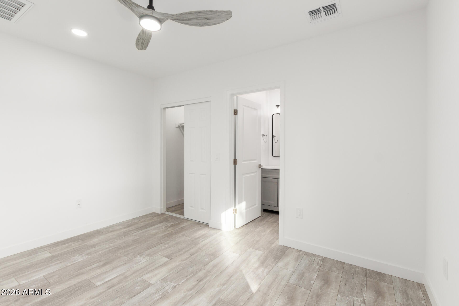 9309 West Adams Street Tolleson, AZ 85353 - Photo 13 of 29 wooden floor in an empty room