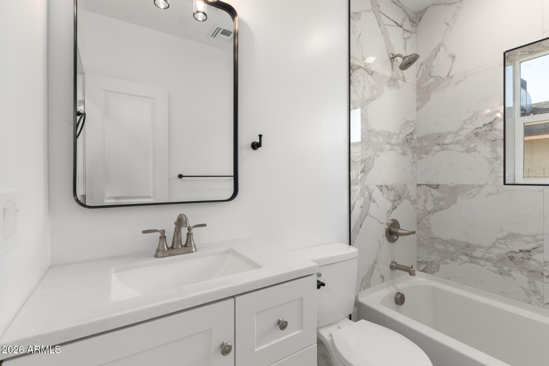 9309 West Adams Street Tolleson, AZ 85353 - Photo 19 of 29 a bathroom with a sink a toilet and shower