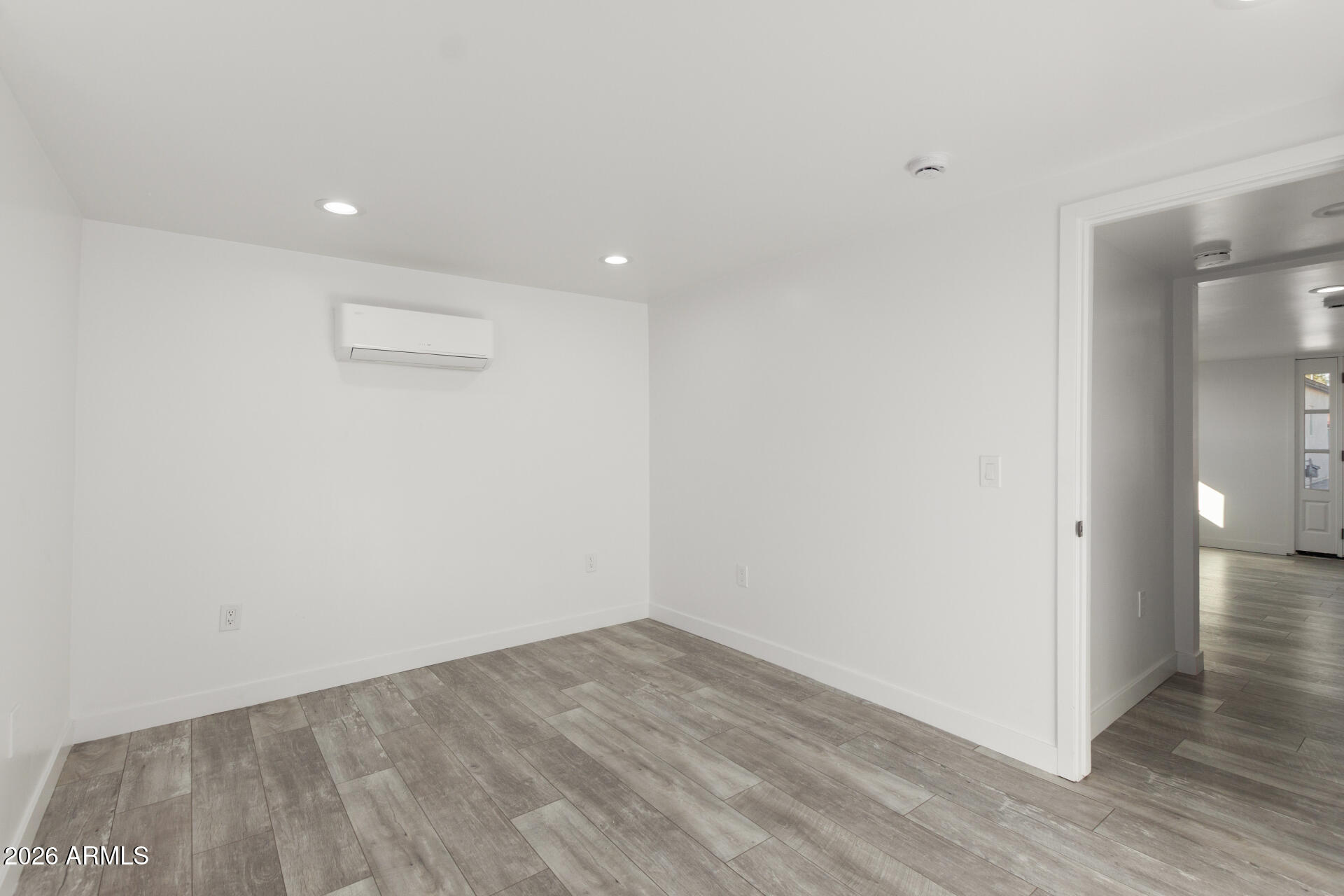 9309 West Adams Street Tolleson, AZ 85353 - Photo 20 of 29 a view of empty room with wooden floor