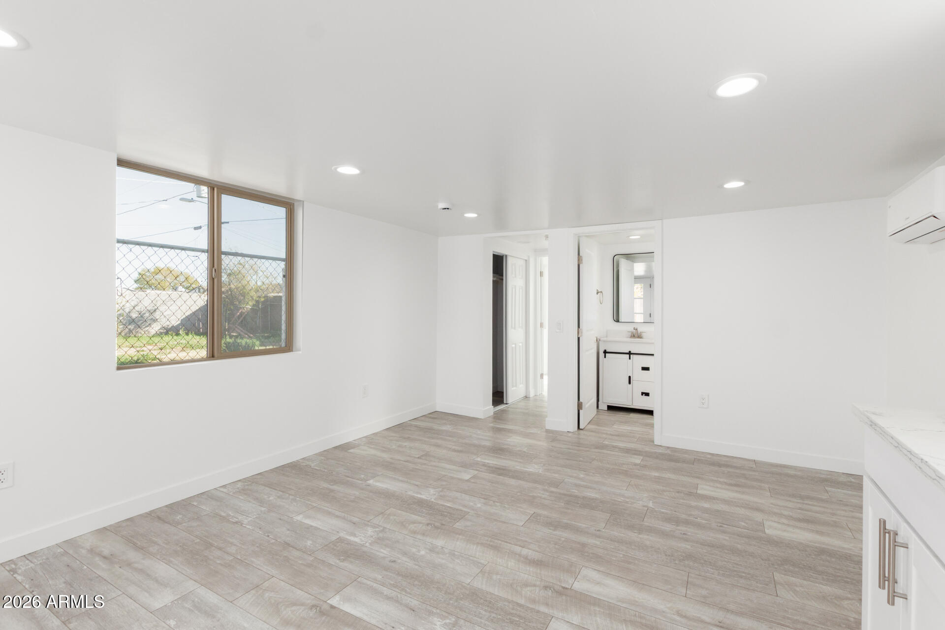 9309 West Adams Street Tolleson, AZ 85353 - Photo 22 of 29 a view of an empty room with a window