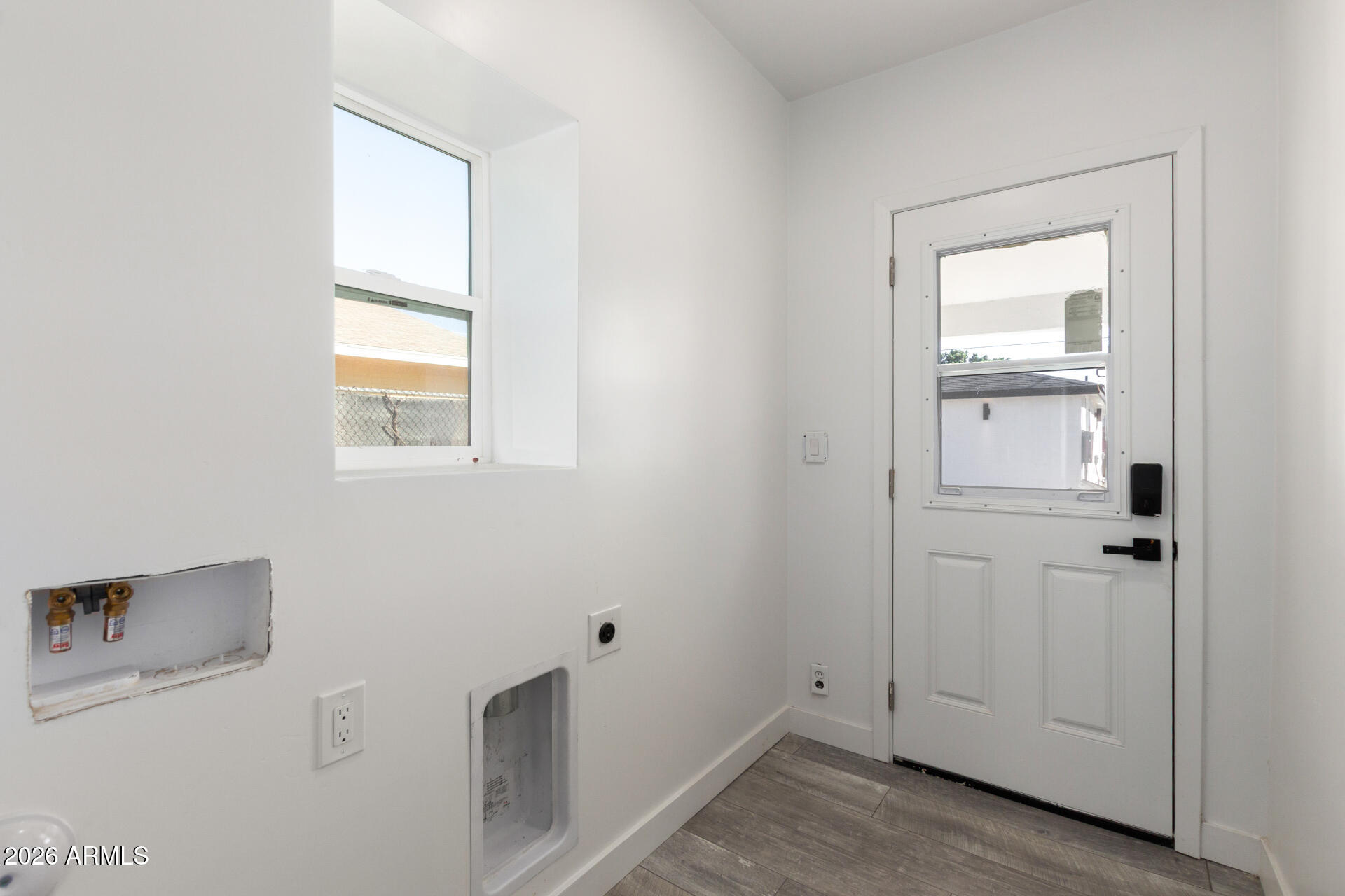 9309 West Adams Street Tolleson, AZ 85353 - Photo 24 of 29 a view of an empty room with a window