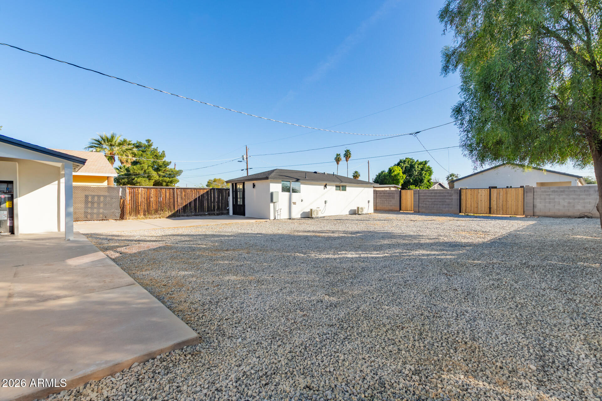 9309 West Adams Street Tolleson, AZ 85353 - Photo 27 of 29 a front view of a house with a yard