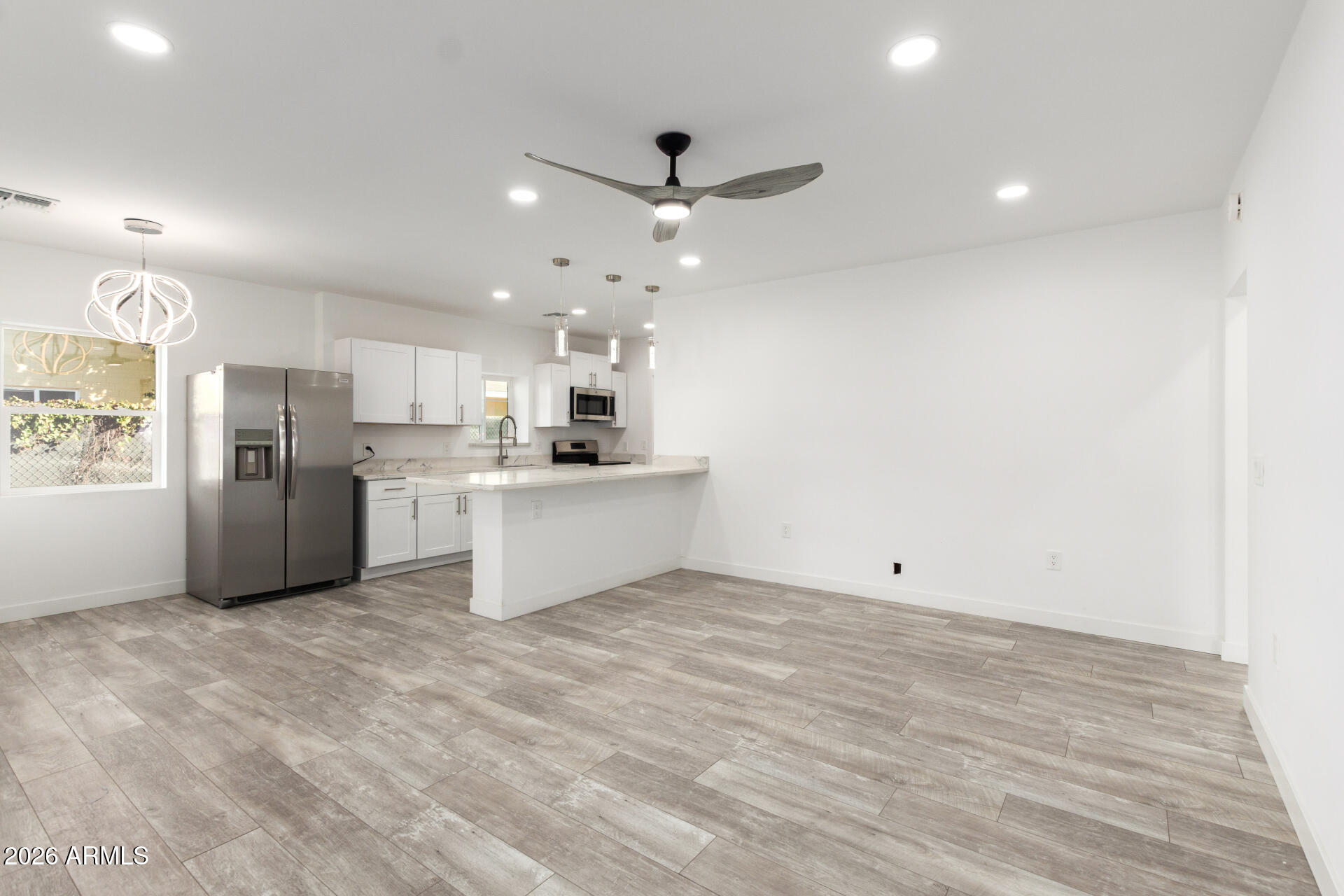 9309 West Adams Street Tolleson, AZ 85353 - Photo 4 of 29 a view of kitchen with wooden floor