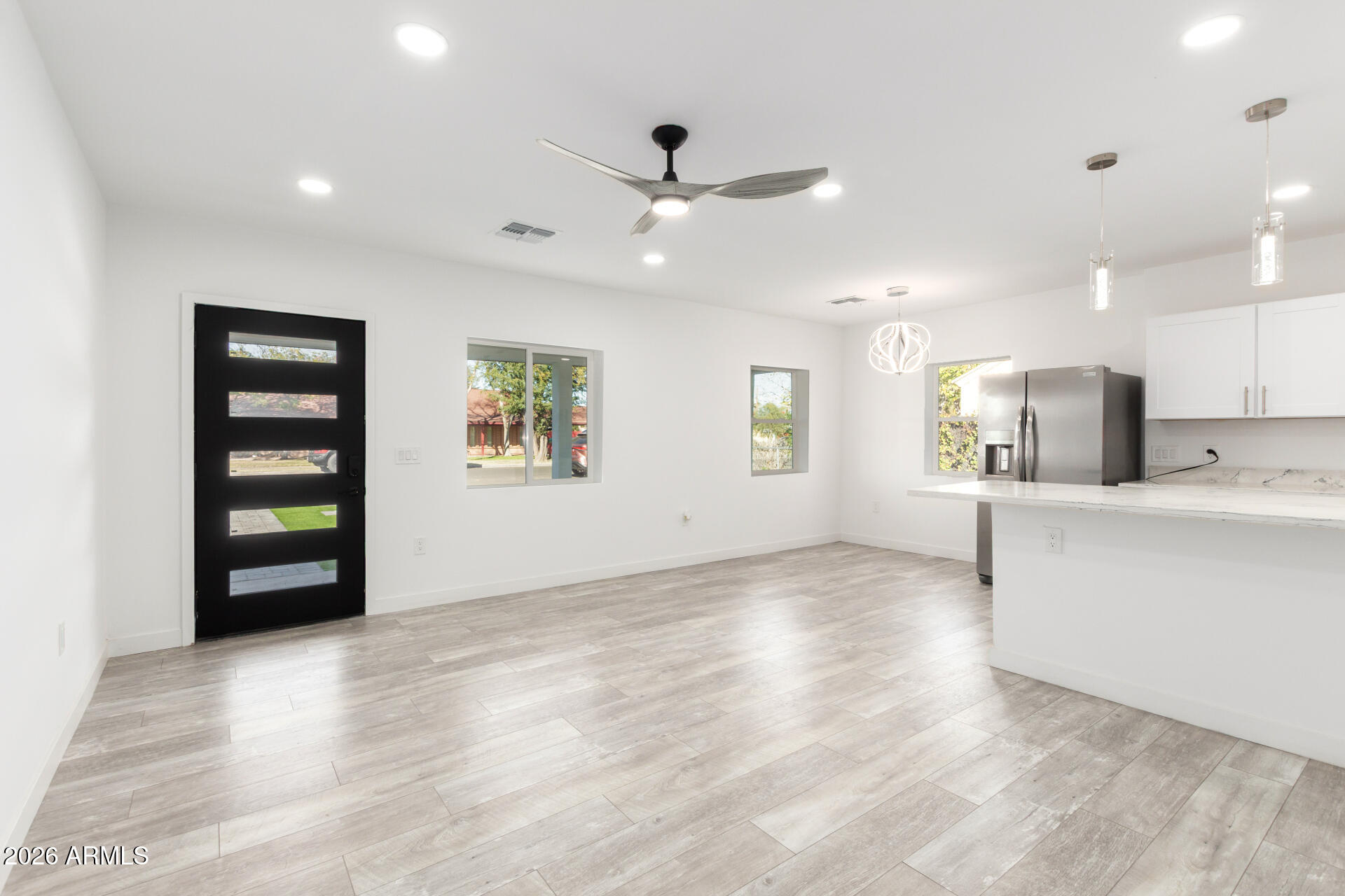 9309 West Adams Street Tolleson, AZ 85353 - Photo 5 of 29 a view of kitchen with sink and window