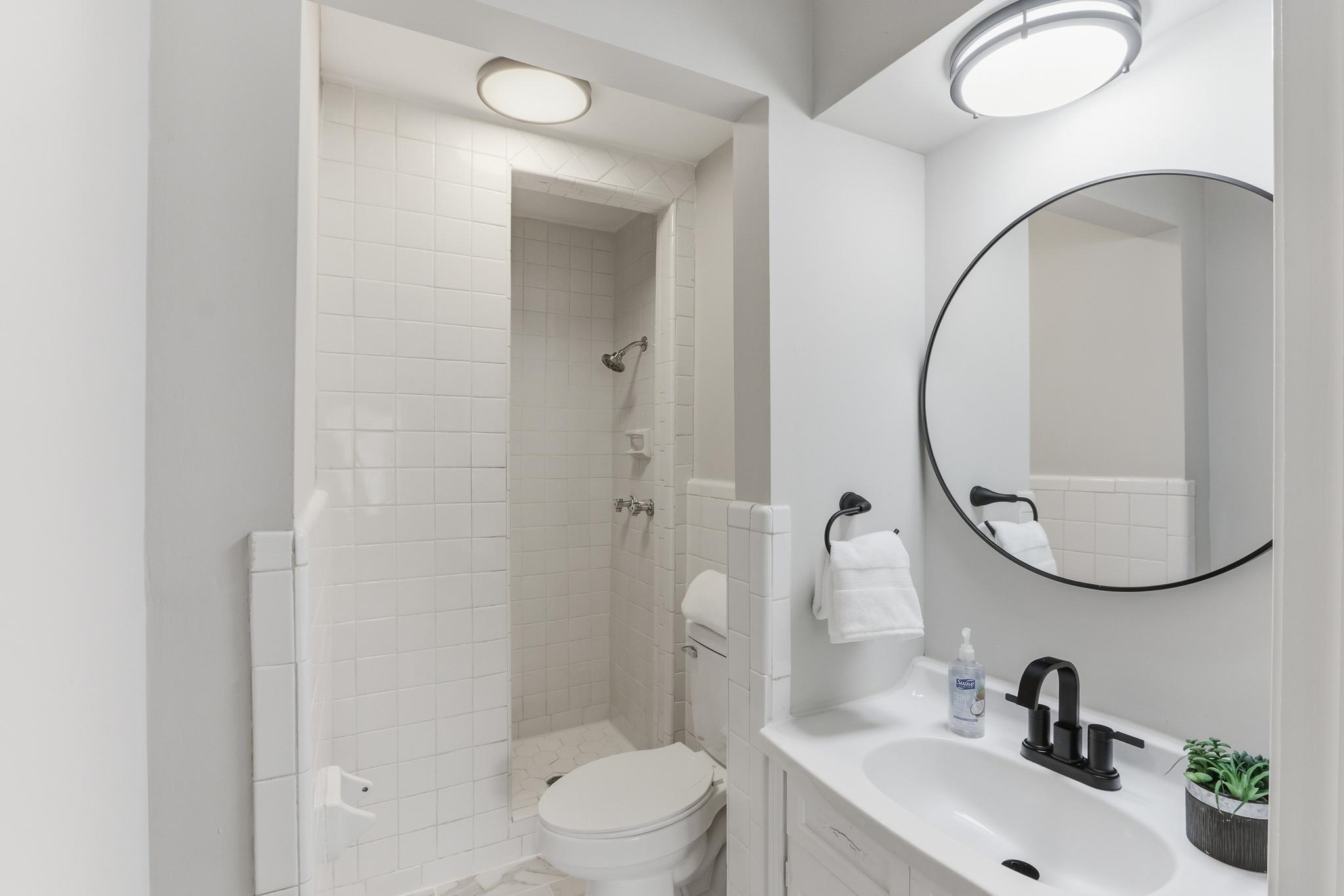 312 Fernway Road Memphis, TN 38117 - Photo 8 of 38 Bathroom with vanity and a walk in shower