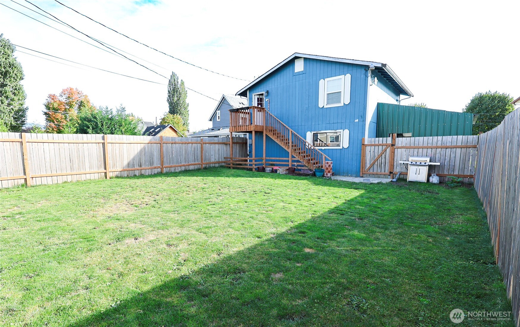 136 First Street Sumas, WA 98295 - Photo 4 of 20 a view of a house with a yard and sitting area