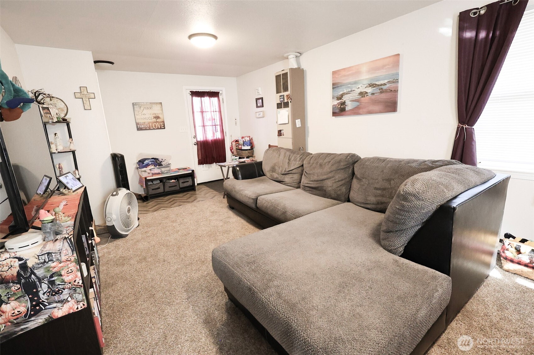 136 First Street Sumas, WA 98295 - Photo 6 of 20 a living room with furniture and a flat screen tv