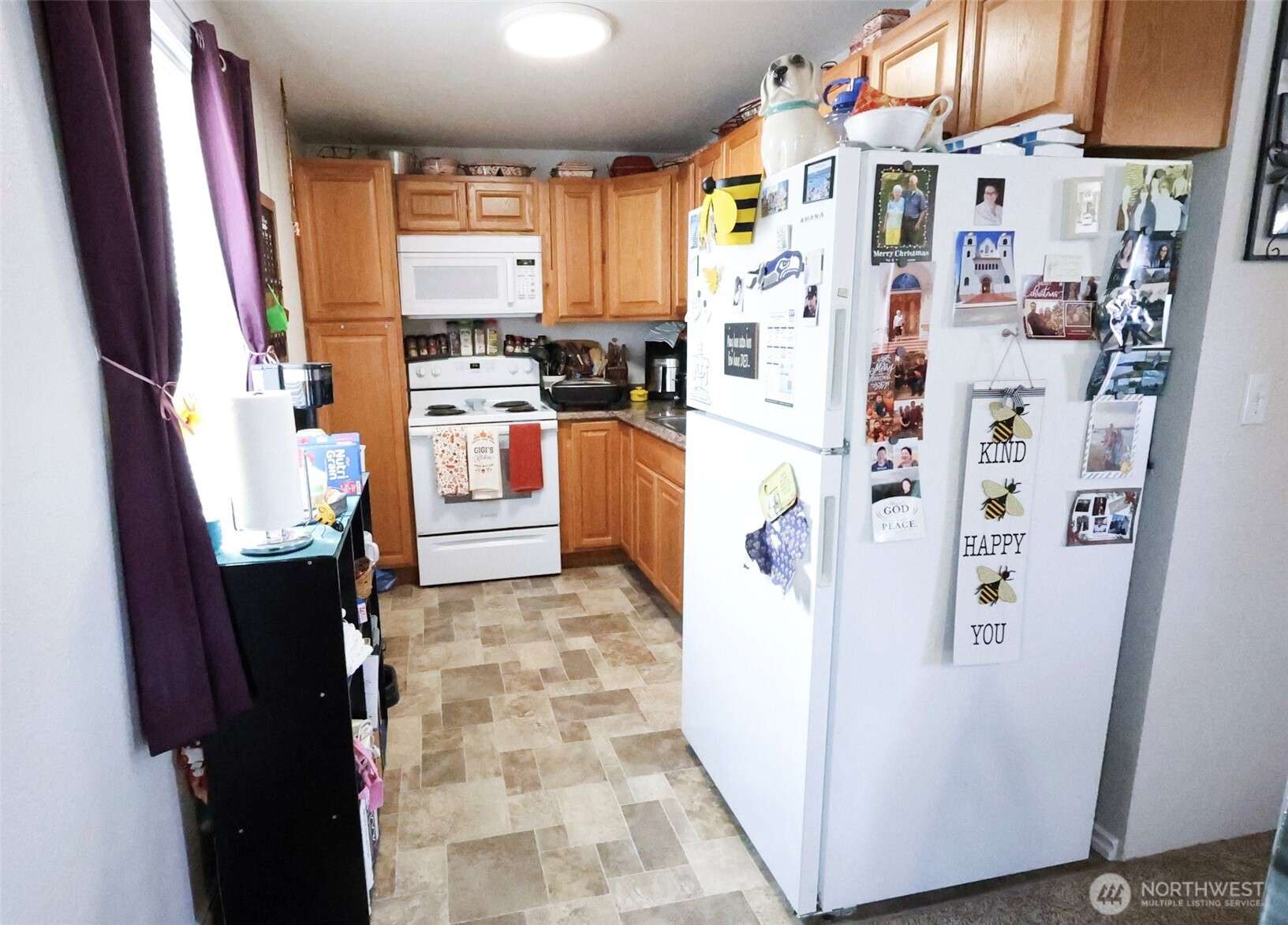 136 First Street Sumas, WA 98295 - Photo 8 of 20 a white refrigerator freezer sitting inside of a kitchen