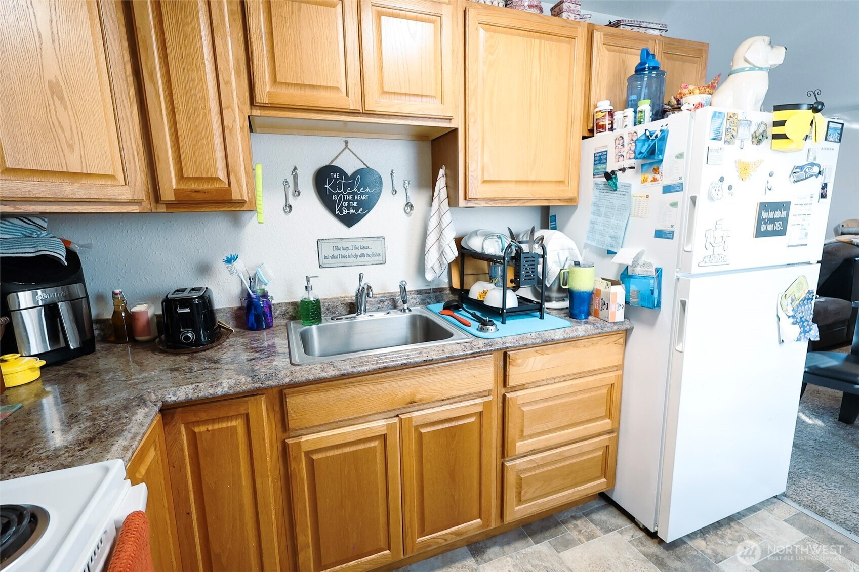 136 First Street Sumas, WA 98295 - Photo 9 of 20 a kitchen with stainless steel appliances granite countertop a refrigerator sink and cabinets