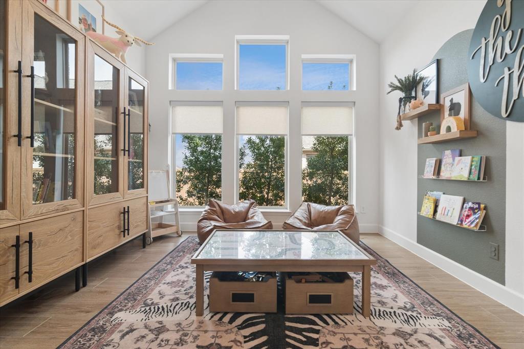 582 Broadleaf Way Haslet, TX 76052 - Photo 12 of 38 a living room with fireplace furniture and a large window