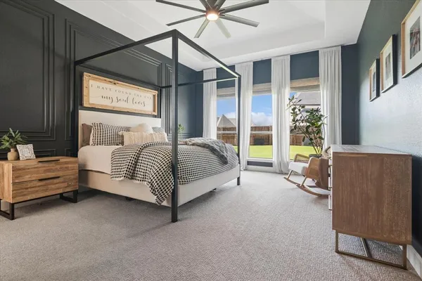 a spacious bedroom with a bed and window