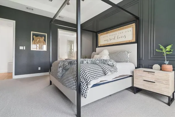 a bedroom with a bed and window