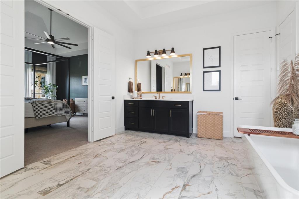 582 Broadleaf Way Haslet, TX 76052 - Photo 20 of 38 a spacious bathroom with a tub sink and mirror