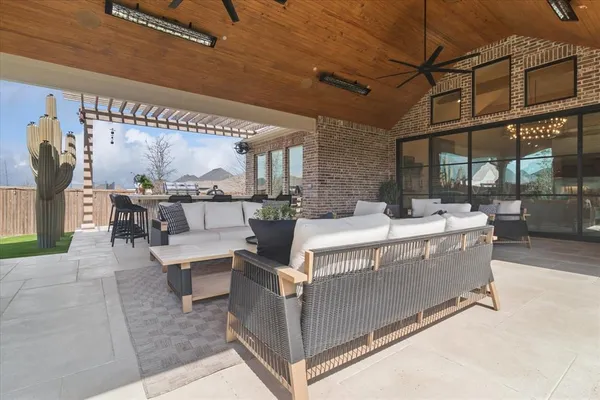 a living room with furniture a fireplace and a table